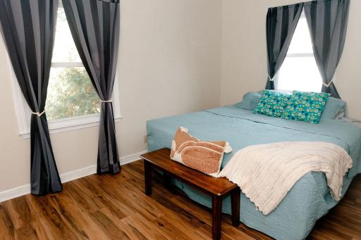 Primary bedroom on main with new flooring and a built-in dresser/closet!
