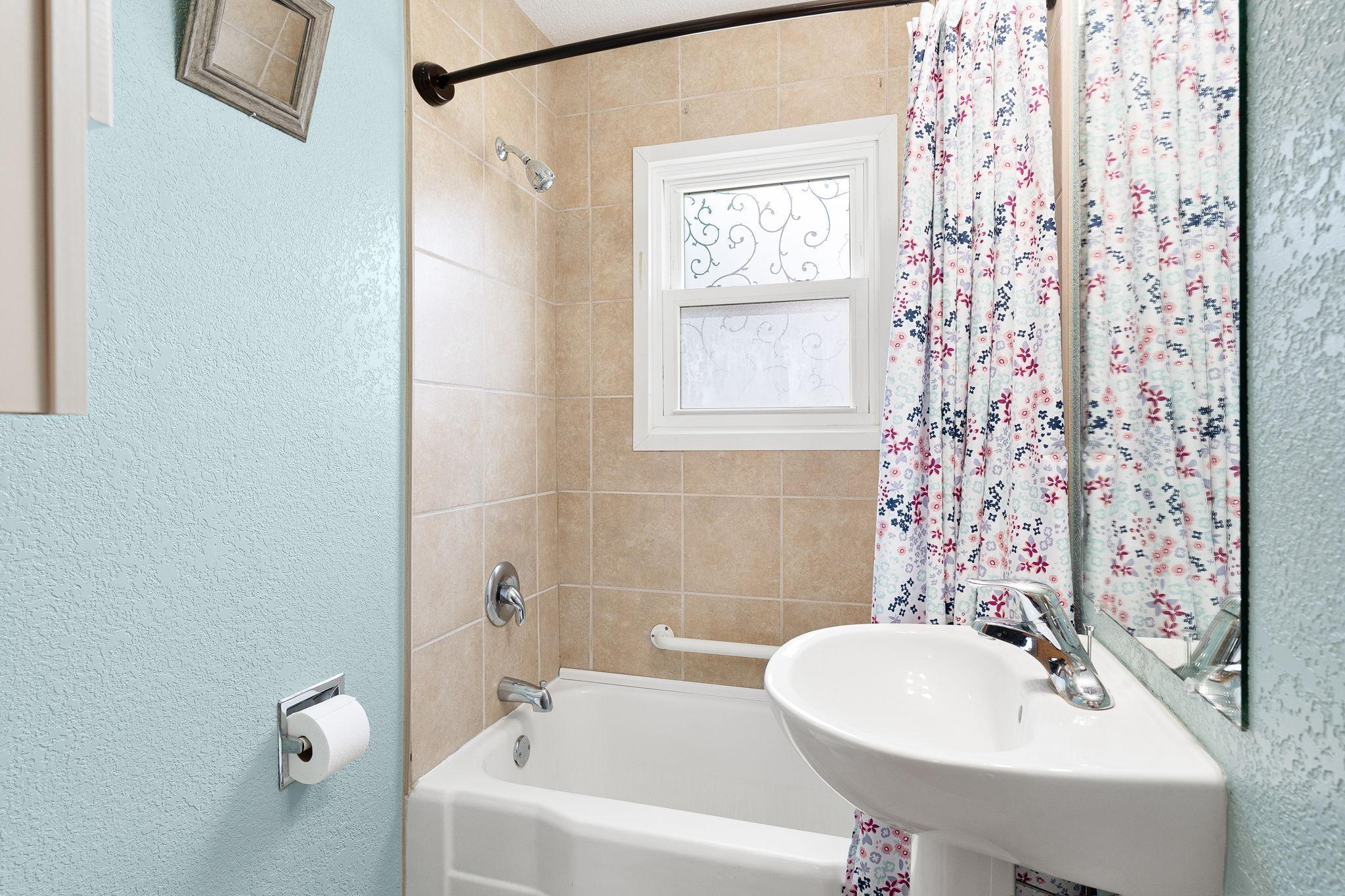 Full Bathroom with Tiled Shower
