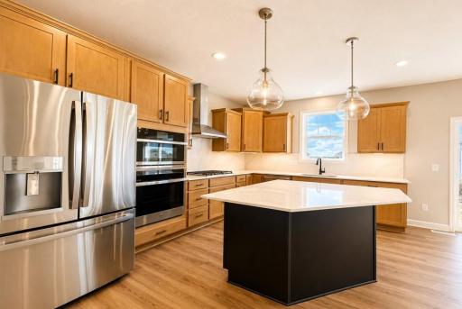 (Photo is of the actual home.) The kitchen naturally operates as the heart of this home, offering ample countertop space and brand-new appliances that will inspire attempts at new recipes.