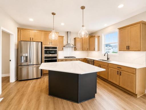 (Photo is of the actual home.) Elevate culinary creations with cutting-edge stainless steel double wall ovens, designed for precision and performance