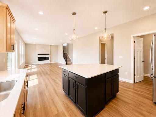 (Photo is of the actual home.) The center island overlooks the rest of the home in an ideal set-up for everyday living