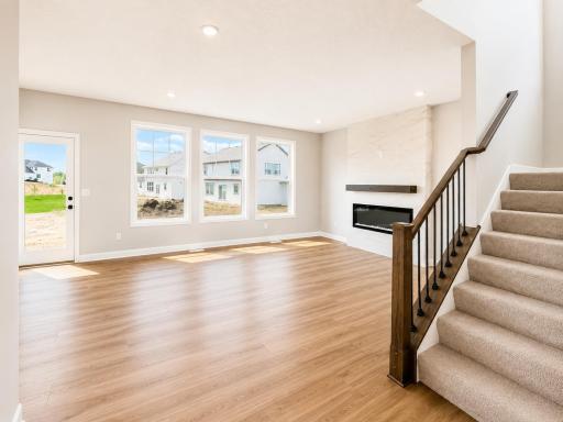(Photo is of the actual home.) The Great Room provides a natural gathering space within the home for residents to rest and relax on the couch after a long day of play.