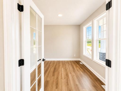 (Photo is of the actual home.) A first-floor office is situated just off the entry, ideal for working remotely or getting paperwork done.