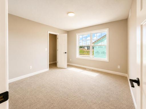 (Photo is of the actual home.) With four bedrooms in total, this home is ideal for households that need space.