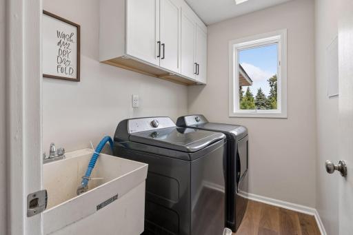 Main floor laundry room with brand new washer and dryer.