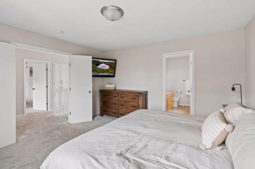 Upper level primary bedroom with private ensuite.