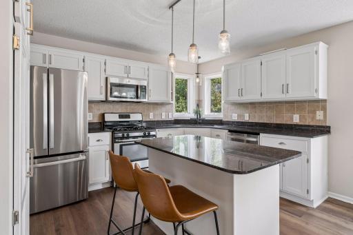 Spacious kitchen island with breakfast area.