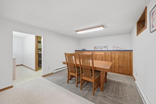 Game area / puzzling / workout area? And there is lots of storage behind in the cabinets.