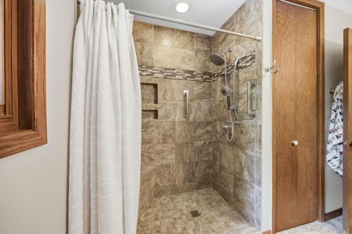 Main floor large bath with updated walk-in shower. And... there is an additional storage closet.