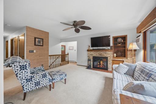 Another view of the main floor living room and fireplace area.