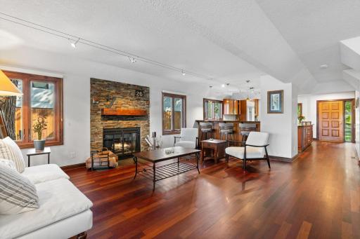 Focal point of the living room is the striking stone fireplace.