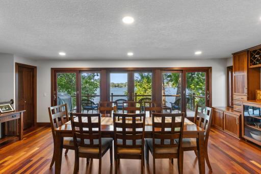 Three sets of patio doors provide incredible views and walks out to large deck overlooking the lake.