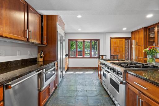 Premium stainless steel appliances include double ovens, refrigerator and dishwasher.