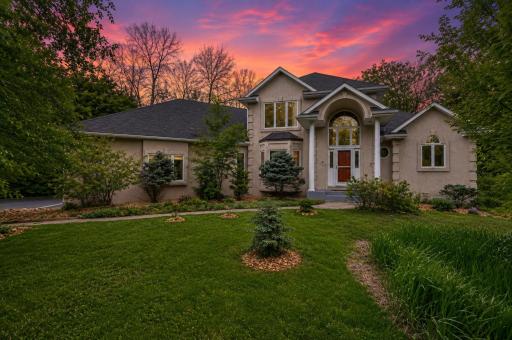 Crafted by renowned luxury builder John Kraemer & Sons, this exceptional executive residence is set on one of the most remarkable one-acre properties located within the prestigious Minnetonka Public Schools district.