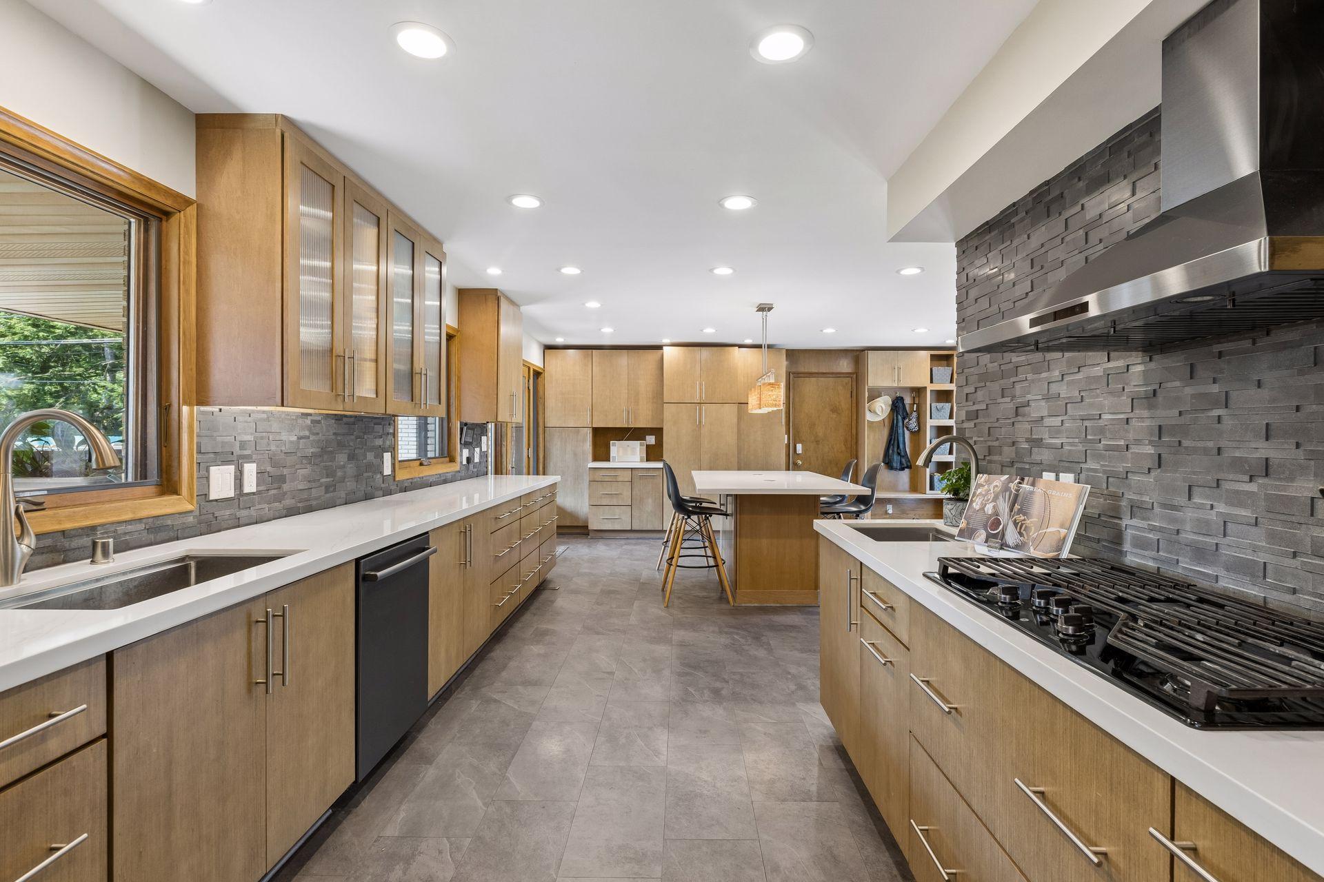 The kitchen just goes on and on, and connects to the garage for easy living!