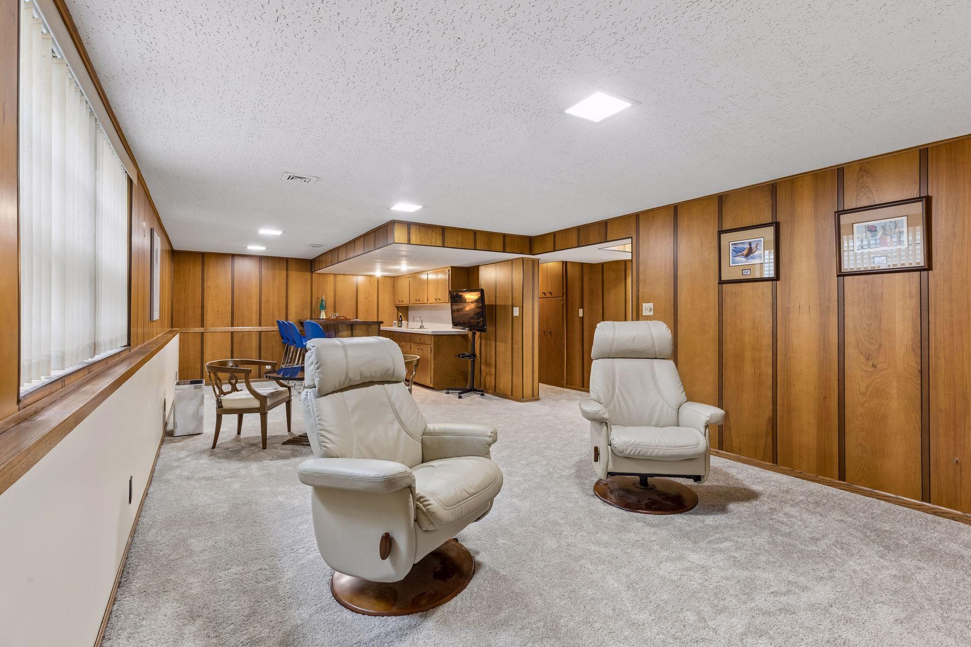 Custom wood paneling make this space cozy and authentically mid-century!