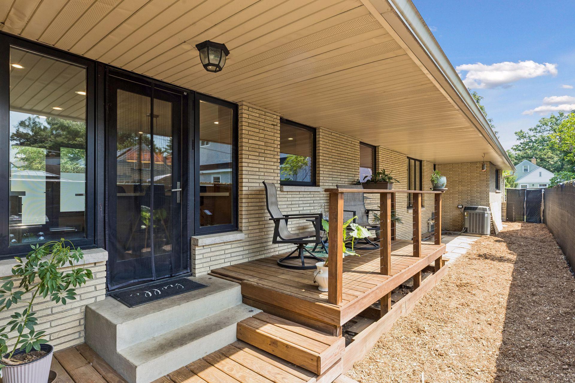 A charming deck just off the kitchen offers a functional outdoor space to enjoy your morning coffee or unwind in the evening.