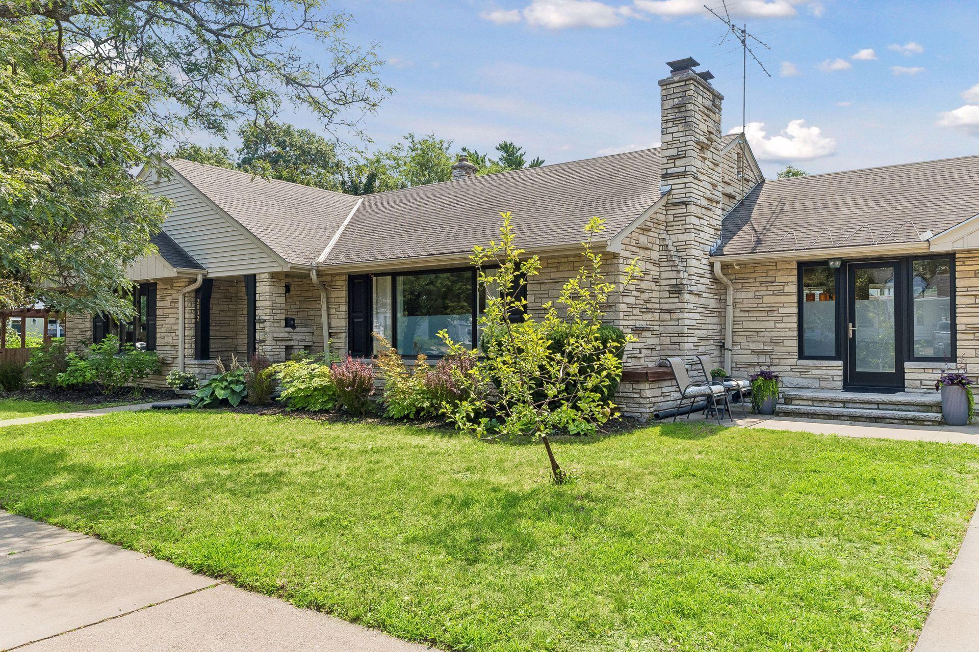 Well-maintained landscaping and an updated exterior create fantastic curb appeal.