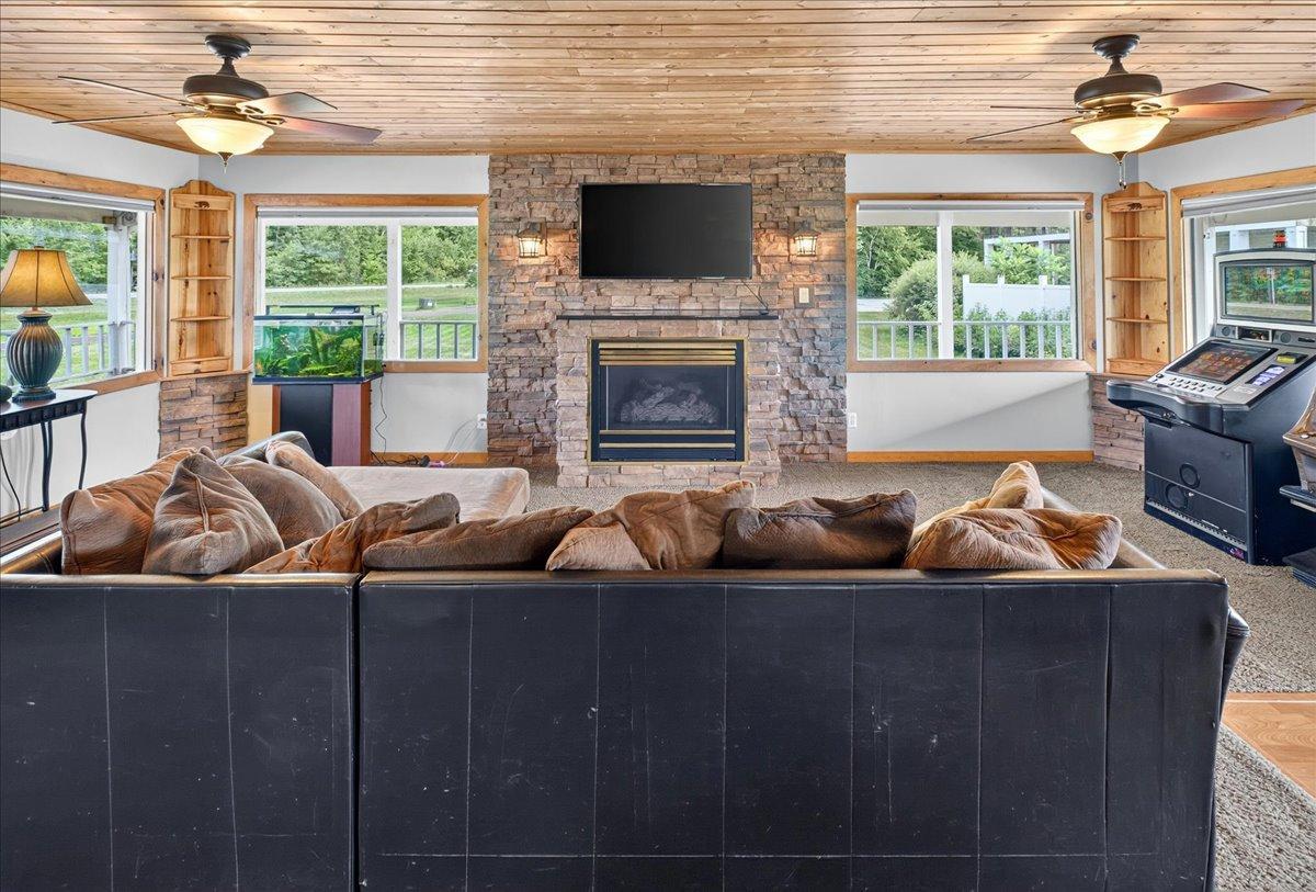 Fireplace, TV and views of the deck.