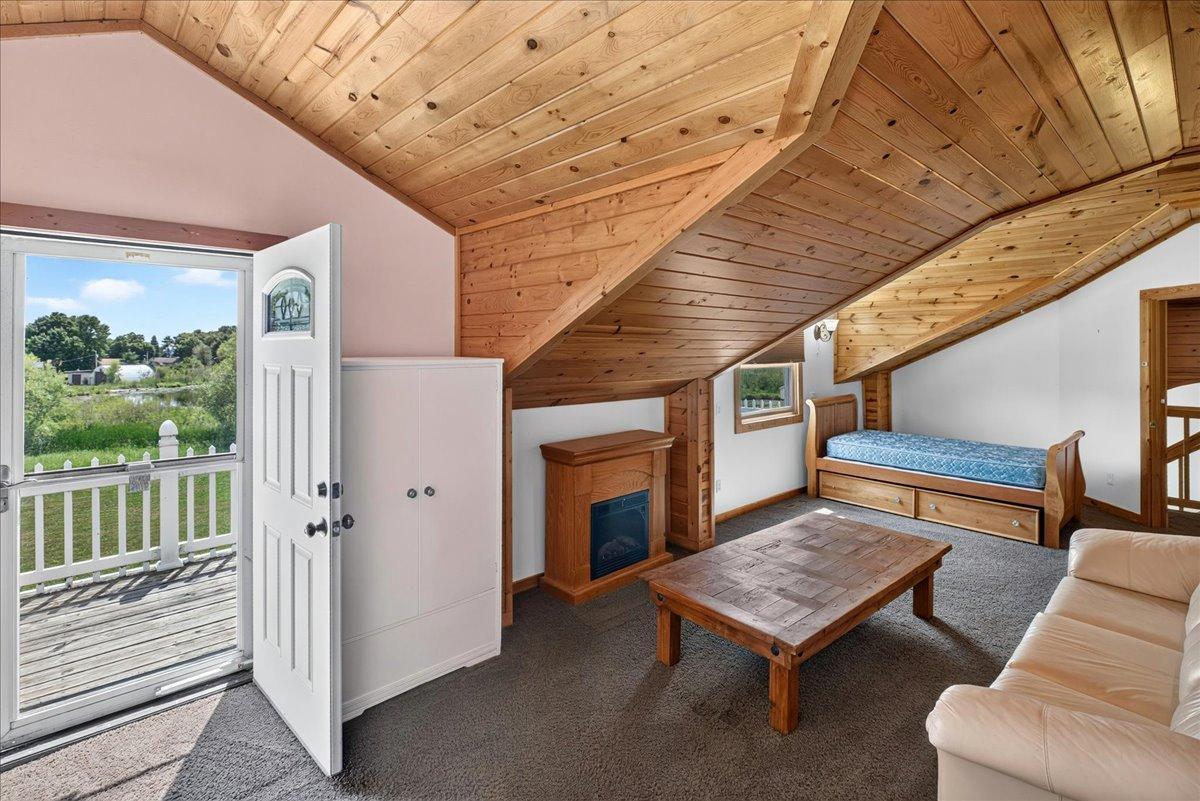 Top living Space with the deck, fireplace, & privacy.