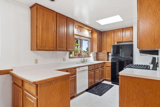 Kitchen with backyard views from bay window.