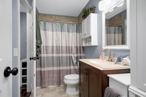 Upper-level full bathroom has access from the hallway and the primary bathroom. .