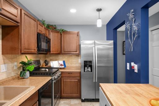 Upgraded cabinets, counters, and backsplash!