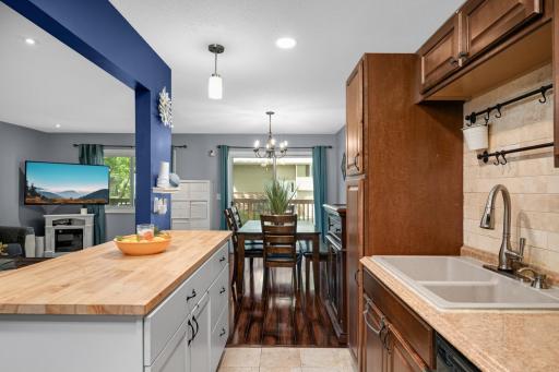 Updated island cabinet with butcher-block counter! Note the wall has been opened up to allow views of the living area.