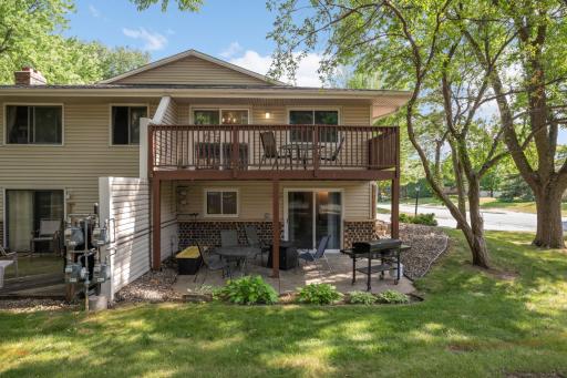 View of the great outdoor spaces! Both the patio and the deck are larger than most quad-style townhomes.