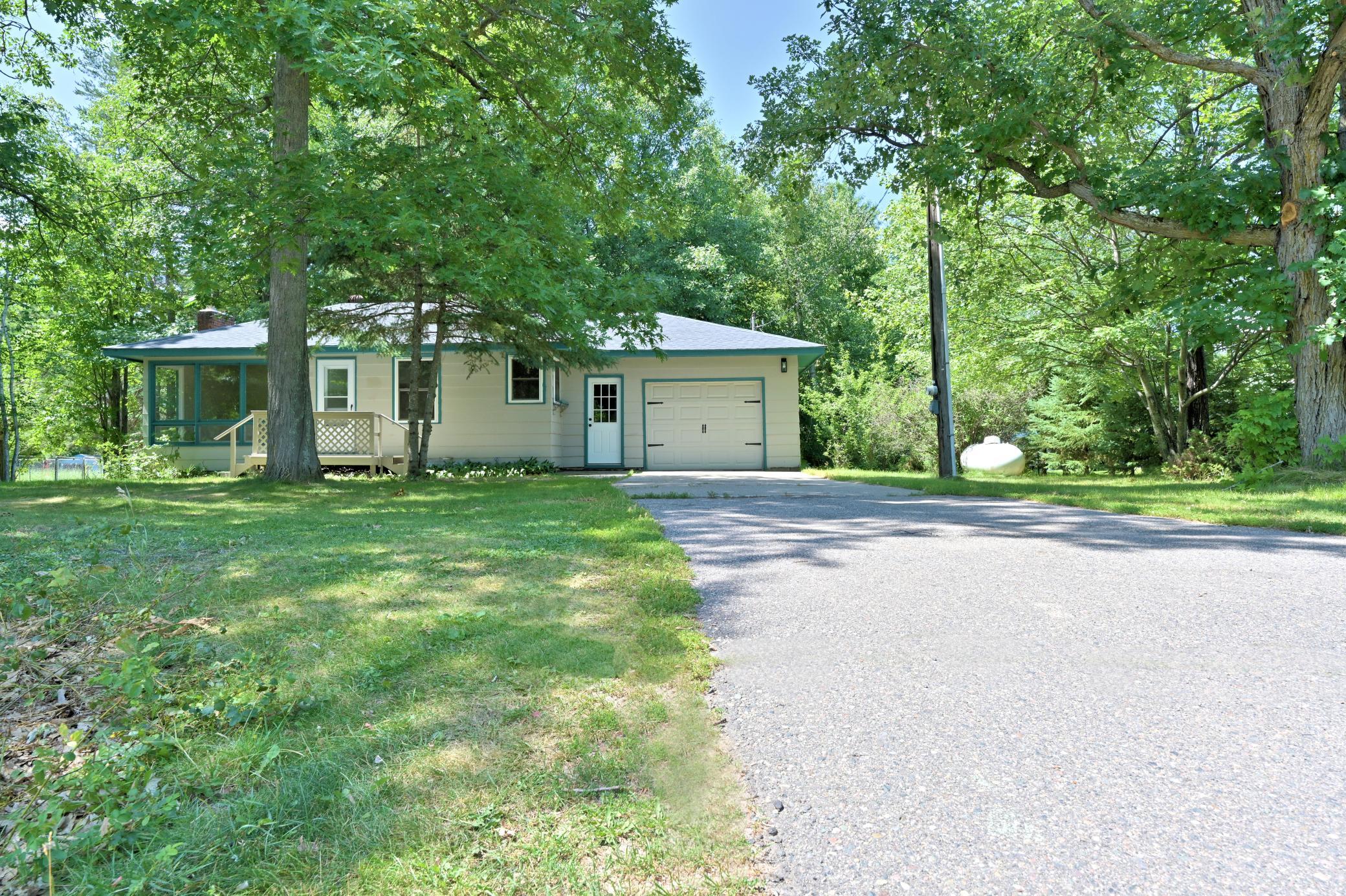 FRONT EXTERIOR WITH TAR DRIVEWAY.jpg