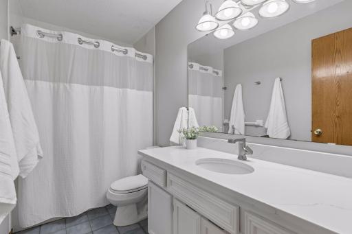 Full bathroom on the upper level with new Quartz countertops.
