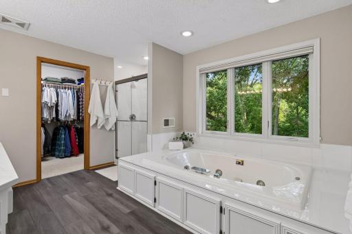 Plus, a large soaking tub with a NEW tiled surround and a freshly tiled shower and new shower door.