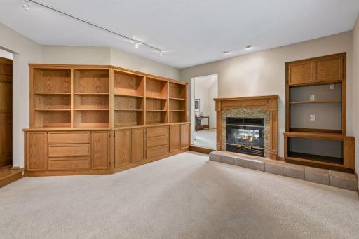This home has a really fun floorplan with lots of rooms on the main level. The flex room is in between the living room and sunroom and boasts all these wonderful built-in bookshelves.