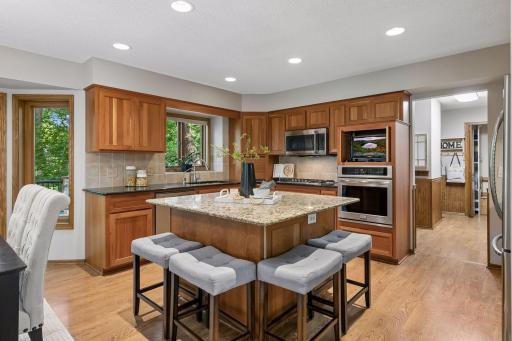 You will love working in this upgraded kitchen! The kitchen features granite countertops, stainless steel appliances, an abundance of soft close cabinetry and pull outs.