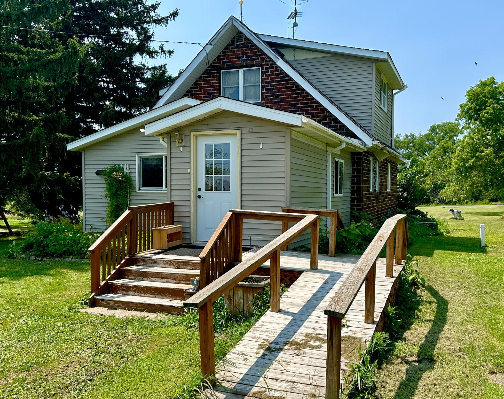The main entrance to the home has a ramp for wheelchair access as well as stairs.