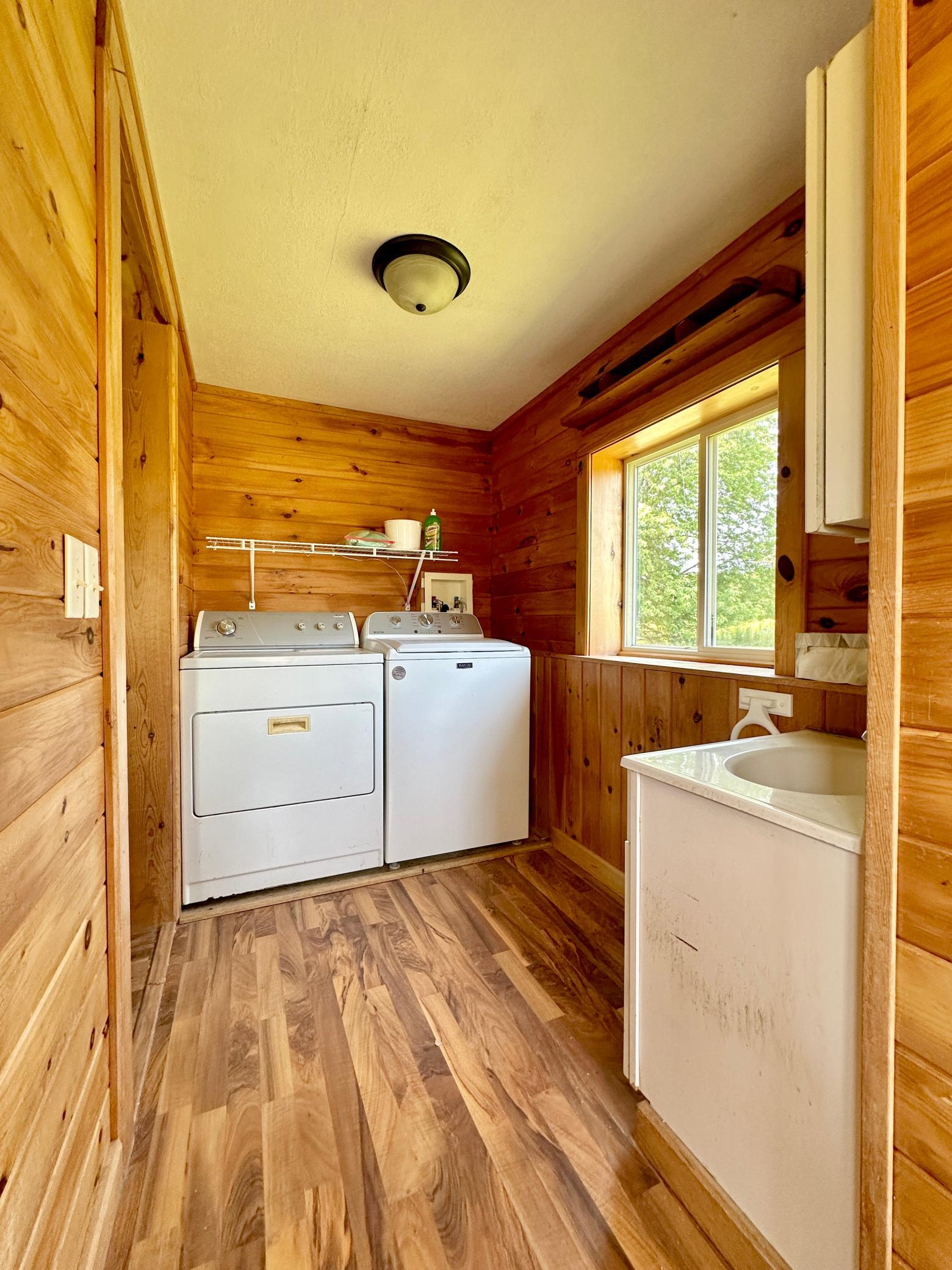A better view of the laundry space, it's naturally bright with the large window in the room.