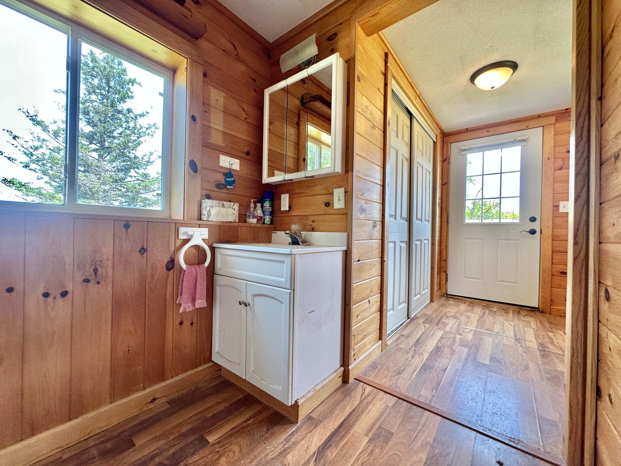 A few steps in is the laundry area with sink.