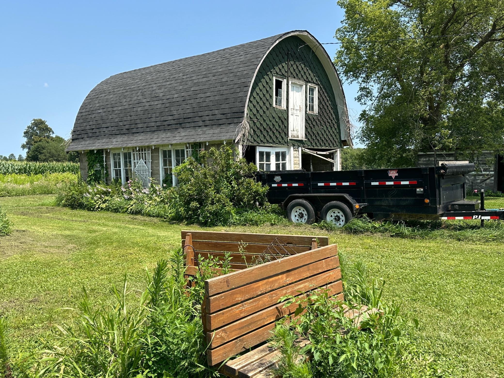 The garage and other buildings need some attention. This garage is cool with an upstairs to make it what you want.