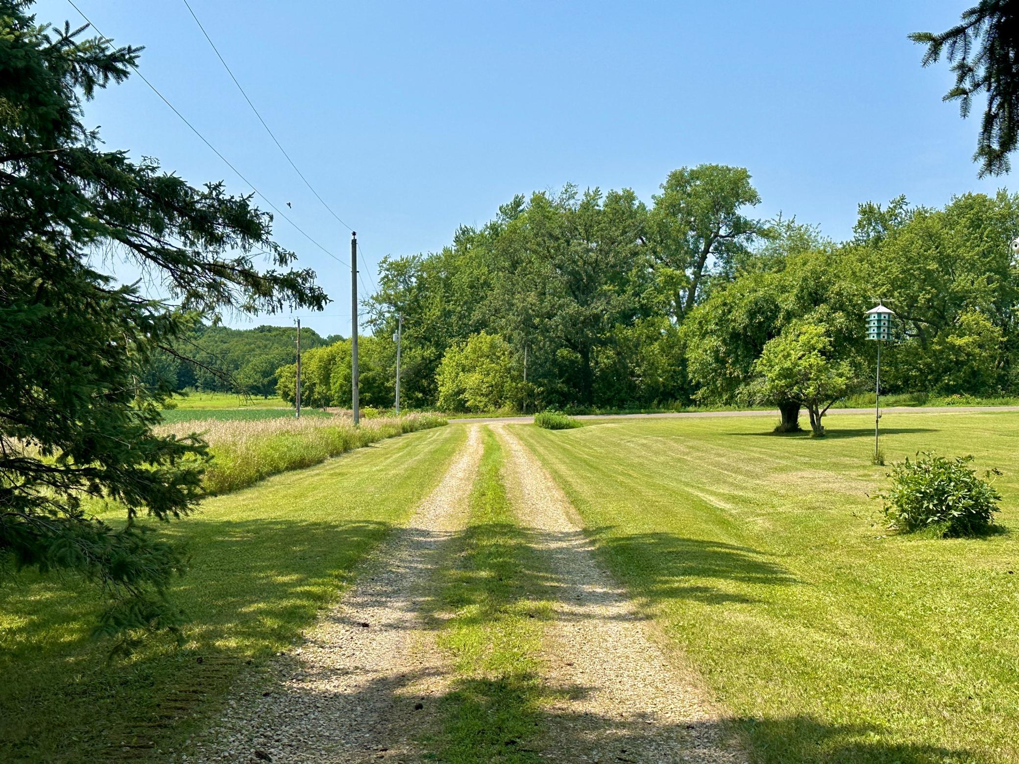 The home is nicely tucked back off the road, this view looking out to the road.