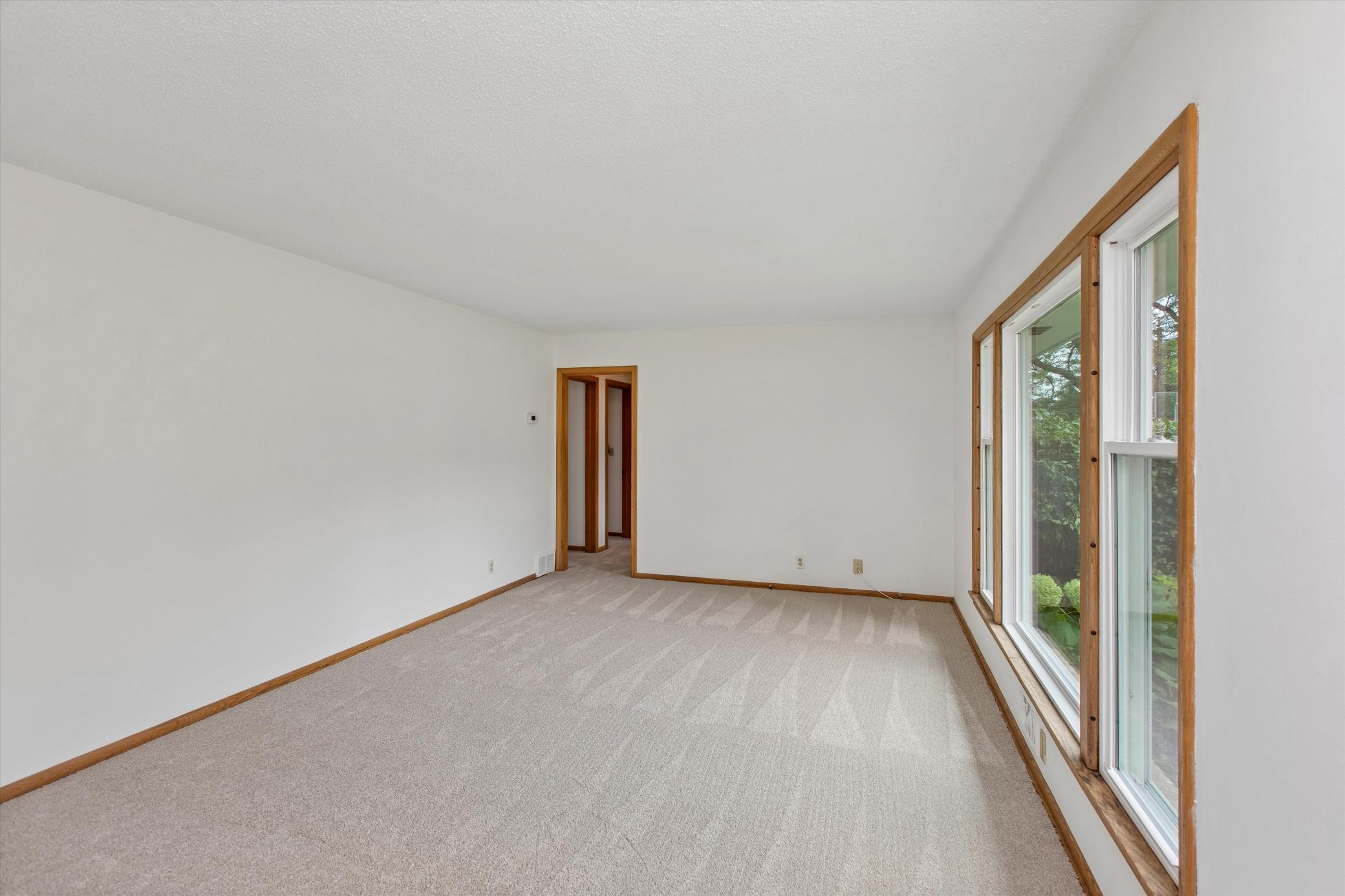 Living room large enough to accommodate many furniture arrangements