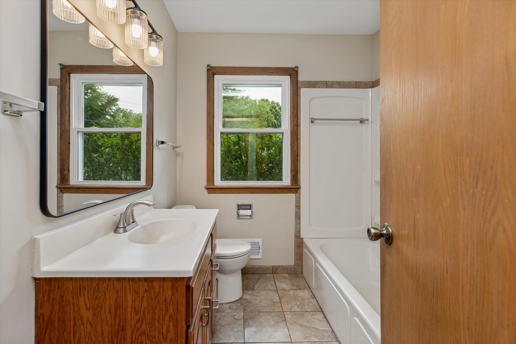 Tile floors & linen closet in the main bathroom