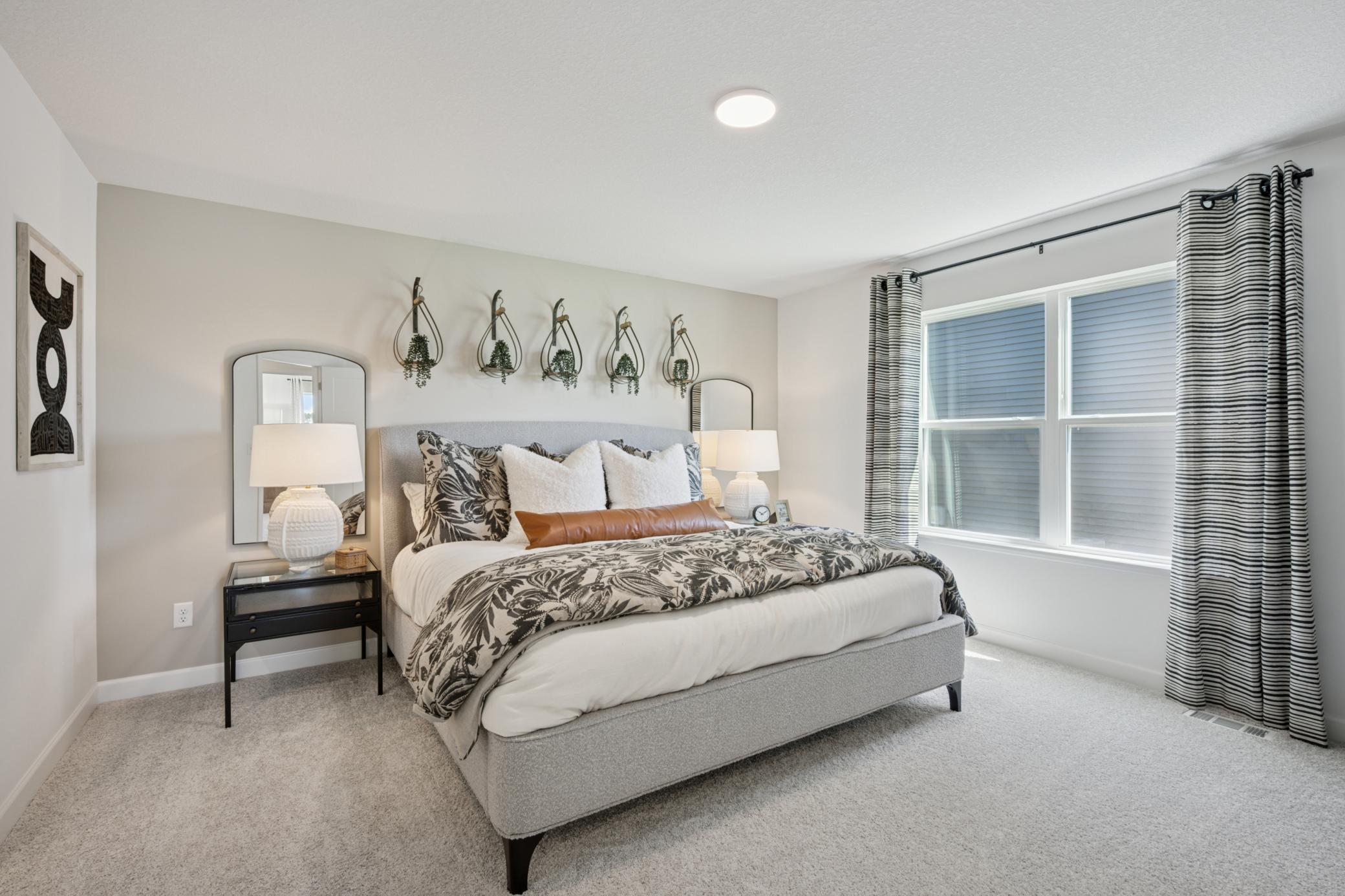 *Photo of model home, actual features may vary. Find your retreat in this stunning primary suite. Enjoy the exclusivity of a private bath and walk-in closet.