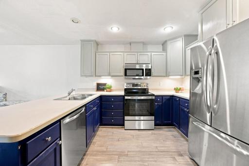 You are going to LOVE cooking here! Plenty of cupboard and counter space and a nice open floorplan!