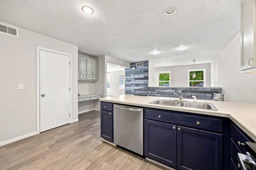 Open into the dining area and also offers a pantry and desk space