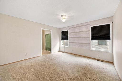 Primary suite features spacious bedroom, attached FULL bathroom, and walk in closet