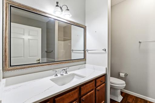 Attractive finishes and woodwork in the full bath.