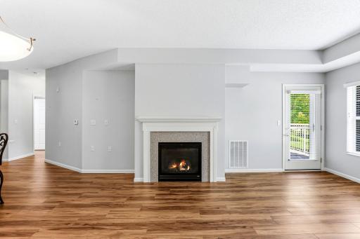 A lovely gas fireplace warms the wonderful open spaces.