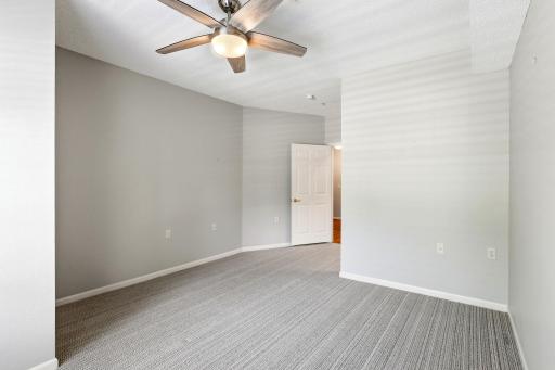 The spacious bedroom flow to the hallway, bathroom and walk in closet.