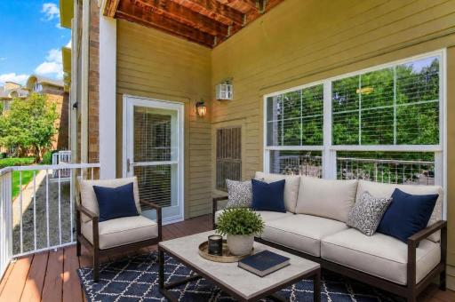 A virtually staged image of the large covered deck area. Only 1st floor homes have this deck size.