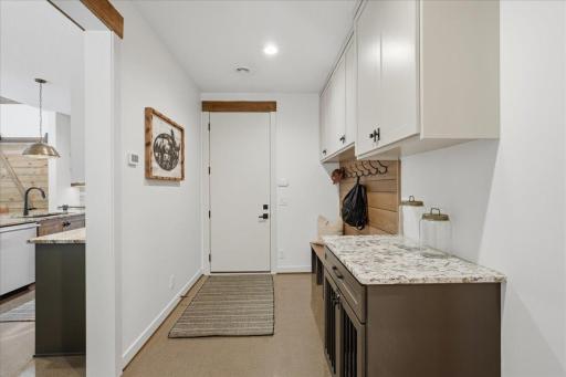 Mudroom from the garage - additional storage and space to hang / hold items that come home.